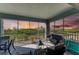 Enjoy sunset views from this screened porch with comfortable seating at 396 Aruba Cir # 103, Bradenton, FL 34209