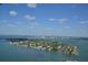 Breathtaking aerial view of a waterfront community with beautiful homes and stunning coastal scenery at 435 Partridge Cir, Sarasota, FL 34236