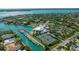 Community aerial view featuring a community center with a pool, tennis courts, and boat docks at 435 Partridge Cir, Sarasota, FL 34236