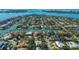 Stunning aerial view of waterfront homes with boat docks on a sunny day at 435 Partridge Cir, Sarasota, FL 34236