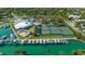 Aerial view of community center with tennis courts, boat docks, and palm trees at 435 Partridge Cir, Sarasota, FL 34236