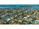 Stunning aerial view of a coastal community with waterfront homes, lush landscapes, and serene waterways at 435 Partridge Cir, Sarasota, FL 34236