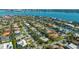 Aerial view of the neighborhood showcasing waterfront homes and views of the city at 435 Partridge Cir, Sarasota, FL 34236