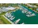 Stunning aerial view of a marina with numerous boats docked in pristine turquoise waters at 435 Partridge Cir, Sarasota, FL 34236