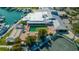 Overhead view of complex with a pool, tennis courts, bocce ball, and boat docks at 435 Partridge Cir, Sarasota, FL 34236
