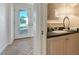 Stylish bathroom with a sink vanity, mirror and a view of the home's exterior at 435 Partridge Cir, Sarasota, FL 34236