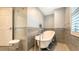 Elegant bathroom with a clawfoot tub, stylish fixtures, and gray tile walls at 435 Partridge Cir, Sarasota, FL 34236