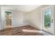 Neutral bedroom with a connecting bathroom, glass block window, and access to the yard at 435 Partridge Cir, Sarasota, FL 34236