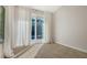 Bright bedroom with sliding glass doors and a view of the pool area at 435 Partridge Cir, Sarasota, FL 34236
