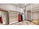 Walk-in closet with built-in shelving and a full-length mirror for wardrobe selection at 435 Partridge Cir, Sarasota, FL 34236