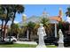 Elegant community center with statues, palm trees, and covered parking at 435 Partridge Cir, Sarasota, FL 34236
