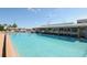 Resort-style pool with lounge chairs and clubhouse offers a relaxing community experience at 435 Partridge Cir, Sarasota, FL 34236