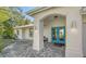 Charming front entrance featuring a blue double door and textured stone pavers at 435 Partridge Cir, Sarasota, FL 34236