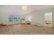 Bright living room with high ceilings, natural light, and wood-look tile floors at 435 Partridge Cir, Sarasota, FL 34236