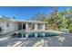 Beautiful pool area featuring a patio with seating, seamlessly connecting the indoor and outdoor living spaces at 435 Partridge Cir, Sarasota, FL 34236