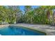 Secluded pool amidst lush tropical foliage offers a serene retreat for relaxation and enjoyment at 435 Partridge Cir, Sarasota, FL 34236
