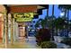 Sidewalk view of shops featuring inviting storefronts and vibrant displays under bright signage at 435 Partridge Cir, Sarasota, FL 34236