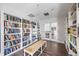 Community library features floor-to-ceiling bookshelves, a bench, and double glass doors at 11120 Sanctuary Dr, Bradenton, FL 34209