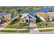 Aerial view of home near lake in a community setting at 13005 Rinella St, Venice, FL 34293