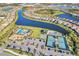 Community pool, tennis courts, and parking area at 13005 Rinella St, Venice, FL 34293