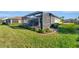 Screened patio with grassy backyard at 13005 Rinella St, Venice, FL 34293