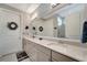 Elegant bathroom with double vanity and large mirror at 13005 Rinella St, Venice, FL 34293