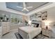 Bright bedroom with wood-like floors and plantation shutters at 13005 Rinella St, Venice, FL 34293