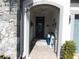 Stone-accented entryway with seating area and decorative accents at 13005 Rinella St, Venice, FL 34293