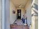 Inviting entryway with decorative accents and a cozy bench at 13005 Rinella St, Venice, FL 34293