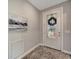 Elegant entryway with a decorative door and stylish wall art at 13005 Rinella St, Venice, FL 34293