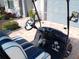 Interior view of a stylish golf cart with blue and white upholstery at 13005 Rinella St, Venice, FL 34293