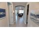 Spacious hallway with light walls and artwork leading to living areas at 13005 Rinella St, Venice, FL 34293