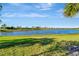 Stunning lake view with lush green landscape and community amenities at 13005 Rinella St, Venice, FL 34293