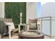 Relaxing balcony with artificial grass wall and fire pit at 1990 Main St # Ph 6, Sarasota, FL 34236