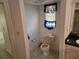 Small bathroom with toilet and window at 25692 Aysen Dr, Punta Gorda, FL 33983