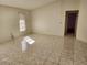 Large bedroom with tile floors and a window at 25692 Aysen Dr, Punta Gorda, FL 33983