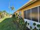 Exterior view of the home's side and landscaping at 25692 Aysen Dr, Punta Gorda, FL 33983