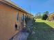 Exterior view of house and landscaping at 25692 Aysen Dr, Punta Gorda, FL 33983