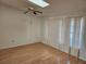 Living room with laminate floors and vertical blinds at 25692 Aysen Dr, Punta Gorda, FL 33983