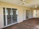 Screened porch with multiple sliding glass doors at 25692 Aysen Dr, Punta Gorda, FL 33983