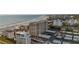 Aerial view showcasing condo building and beachfront location at 6140 Midnight Pass Rd # 407, Sarasota, FL 34242