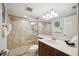 Well-lit bathroom with shower and updated vanity at 6140 Midnight Pass Rd # 407, Sarasota, FL 34242