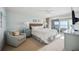 Main bedroom with ocean view, comfy bed, and ensuite bath at 6140 Midnight Pass Rd # 407, Sarasota, FL 34242