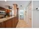 Kitchen features granite countertops and dark wood cabinets at 6140 Midnight Pass Rd # 407, Sarasota, FL 34242