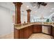 Kitchen with granite countertops and custom wood cabinetry at 6140 Midnight Pass Rd # 407, Sarasota, FL 34242