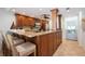 Well-equipped kitchen with granite countertops and wooden cabinets at 6140 Midnight Pass Rd # 407, Sarasota, FL 34242