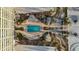 Overhead view of resort-style pool with surrounding amenities at 6140 Midnight Pass Rd # 407, Sarasota, FL 34242