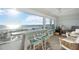 Sunroom with ocean view, features a surfboard bar and seating at 6140 Midnight Pass Rd # 407, Sarasota, FL 34242