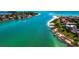 Breathtaking aerial view of waterfront homes and peaceful waterway at 65 Lighthouse Point Dr, Longboat Key, FL 34228