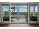 Balcony with water views and outdoor seating at 65 Lighthouse Point Dr, Longboat Key, FL 34228